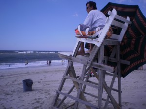 A lifeguard watches over swimmers at an Atlantic Ocean beach