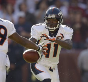 FILE - This Nov. 15, 2009, file photo shows Denver Broncos wide receiver Eddie Royal, obscured at left, faking a handoff to wide receiver Kenny McKinley (11) on a kickoff return against the Washington Redskins during the first half of an NFL football game, in Landover, Md. Arapahoe County Sheriff Grayson Robinson said authorities were called to McKinley's home in Centennial, Colo. at 3:35 p.m. local time Monday, Sept. 20, 2010, and found McKinley's body in the second-floor master bedroom. He said detectives believe McKinley, 23, was killed by a self-inflicted gunshot wound. (AP Photo/Rob Carr, File)