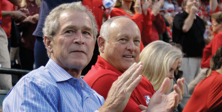 Former president George W. Bush sits with Texas Rangers co-owner Nolan Ryan before Game 1 of baseball's American League Championship Series between the Rangers and New York Yankees Friday, Oct. 15, 2010, in Arlington, Texas. (AP Photo/Chris O'Meara)