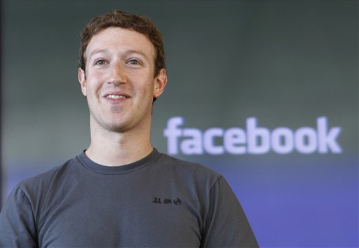 In this Nov. 15, 2010 file photo shows Facebook CEO Mark Zuckerberg smiling at an announcement in San Francisco. Another 17 of America's richest people, including Zuckerberg, junk bond pioneer Michael Milken and AOL co-founder Steve Case, have pledged to give away most of their wealth.  They are the latest to join the Giving Pledge, an effort led by Microsoft founder Bill Gates and investor Warren Buffett to commit the country's wealthiest people to step up their charitable donations. (AP Photo/Paul Sakuma, file)