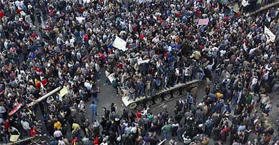 Egyptian demonstrators gather near Cairo's Tahrir Square at the weekend, which saw thousands of anti-government protesters return to the streets chanting slogans against Hosni Mubarak just hours after the Egyptian president fired his cabinet but refused to step down. Photo: AP