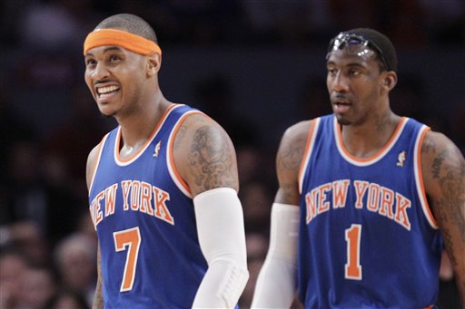 In this Feb. 23, 2011 file photo, New York Knicks' Carmelo Anthony (7) and Amare Stoudemire (1) walk during a break in play in the first half of an NBA basketball game, in New York. The New Jersey Nets wont move to Brooklyn for a year and a half, but with the Nets and New York Knicks battling over marquee players like Carmelo Anthony and erecting in-your-face billboards next to each others arenas, some fans are already talking about reviving a Brooklyn-Manhattan sports rivalry thats been dormant since baseballs Giants and Dodgers left after the 1957 season. (AP Photo/Kathy Willens, file)