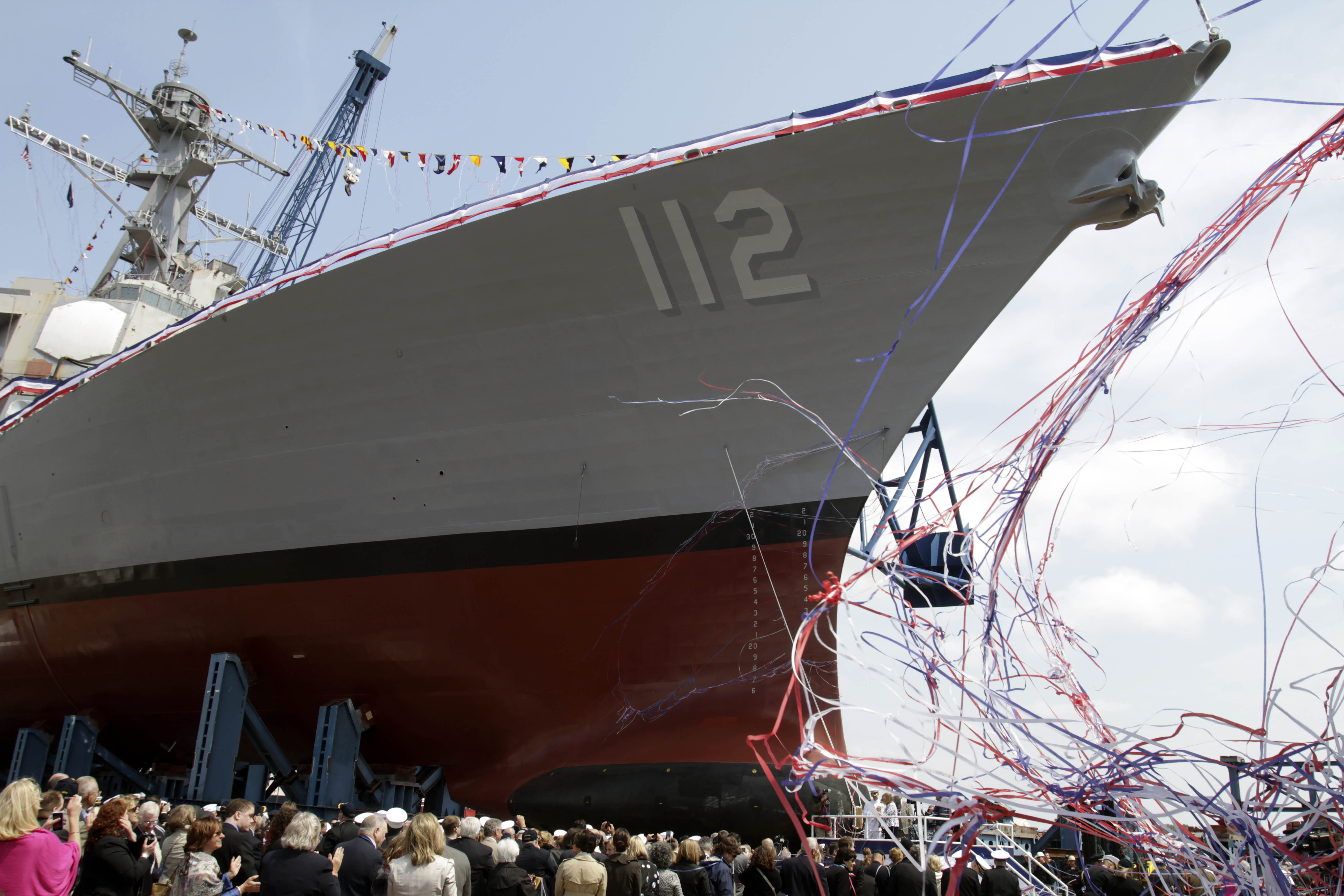 Maureen Murphy, mother of  Medal of Honor recipient and U.S. Navy SEAL, Lt.  Michael Murphy, christens the ship baring his name during a ceremony at the Bath Iron Works shipyard in Bath, Maine on Saturday, May 7, 2011, what would've been Murphy's 35th birthday. The mother of a Navy SEAL from Maine killed in Afghanistan said "Happy birthday, baby" before smashing a bottle of Champagne against a Navy ship that bears her son's name. (AP Photo/Pat Wellenbach)