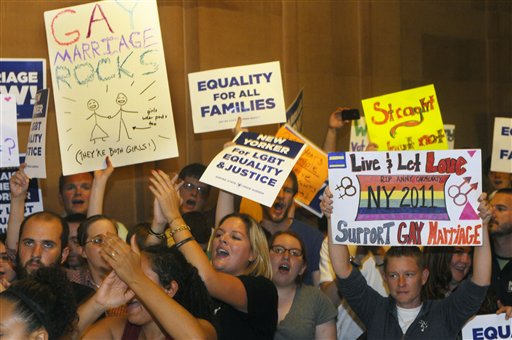 Supporters of same sex marriage celebrate that the Senate members will vote on legislation to legalize same-sex marriage in New York, during a session of the New York State Senate at the Capitol in Albany, N.Y., Friday, June 24, 2011. (AP Photo/Hans Pennink)