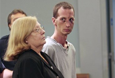 David Laffer, right, and his attorney Mary Elizabeth Abbate, appear in the courtroom for arraignment at First District Court in Central Islip N.Y. Thursday, June 23 2011.  Laffer pleaded not guilty Thursday to murder in the shooting deaths of four people at a Long Island pharmacy during a robbery for painkillers. He was ordered held without bail.   (AP Photo/Victor Alcorn, Pool)