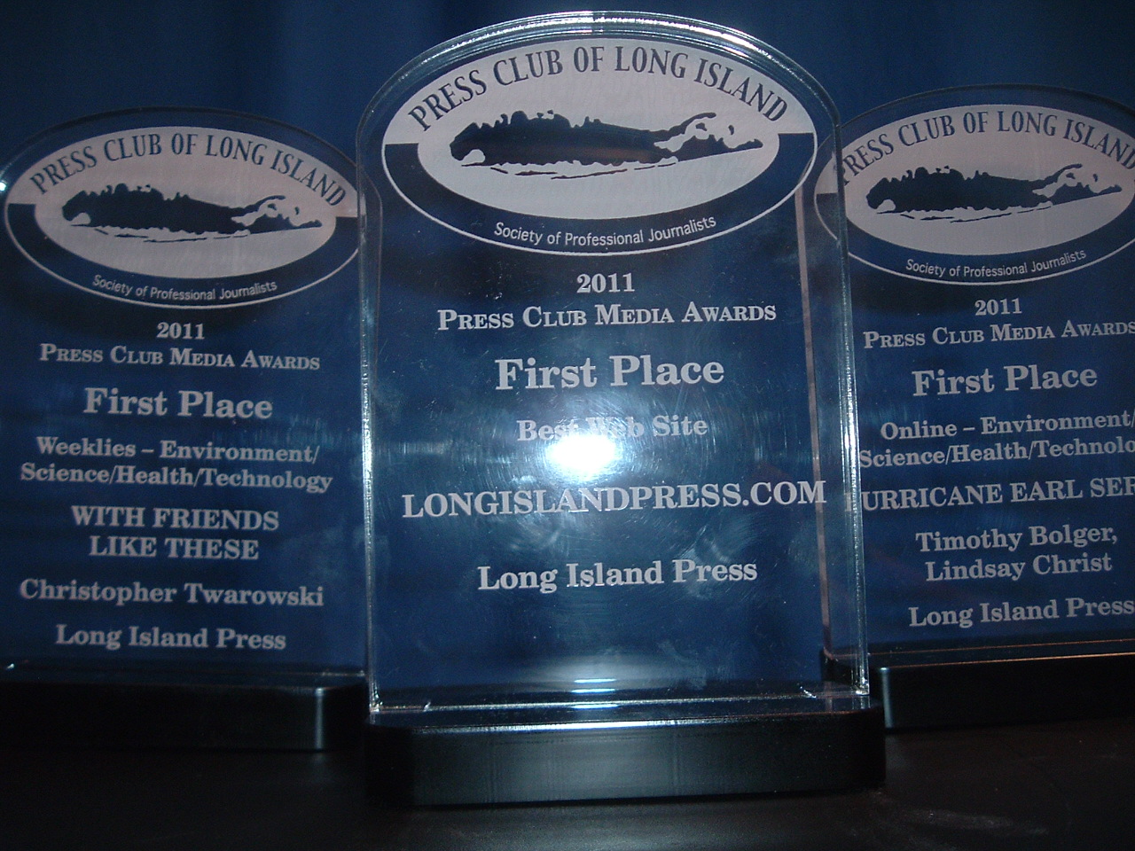 Three of the 22 Press Club of Long Island awards won by the Long Island Press staff Thursday.
