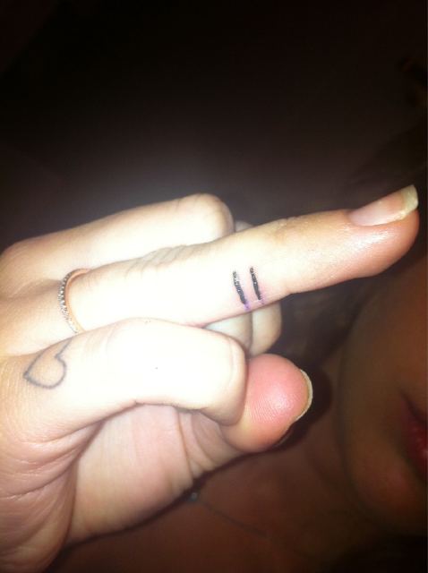 Miley Cyrus showed off her new tattoo on Friday, causing an intense debate among her fans (Photo: Twitter)