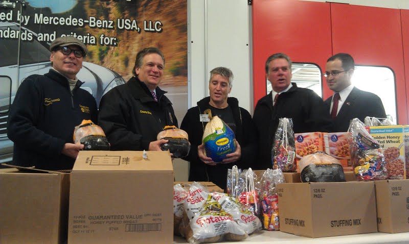 Long Island Cares and Mid Island Collision donate food to needy