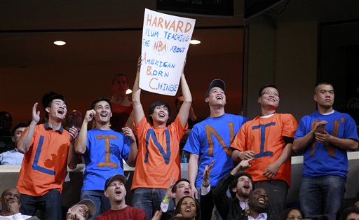 Fans cheer for New York Knicks point guard Jeremy Lin during the second half of an NBA basketball game against the Washington Wizards, Wednesday, Feb. 8, 2012, in Washington. The Knicks won 107-93. (AP Photo/Haraz N. Ghanbari)
