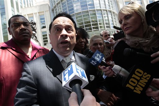 Sen. Pedro Espada speaks to reporters outside Brooklyn Federal court during a luch break,  Friday, May 11, 2012 in New York.  Espada is on trial with his son in Manhattan on charges of embezzlement during his Senate career.   (AP Photo/Mary Altaffer)