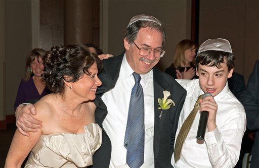 This January 2012 photo released by Randy Sager Photography Inc. shows Izzy Salant, right, toasting his new mother, Bonnie Cole, left, and his father, Jonathan Salant at the couple’s wedding in Rockville, M.D. Brides and bridegrooms who are in the 50s and 60s often have different priorities than their younger counterparts. Baby boomers tend to include their families more in the wedding itself. (AP Photo/Randy Sager Photography, Inc., Randy Sager)