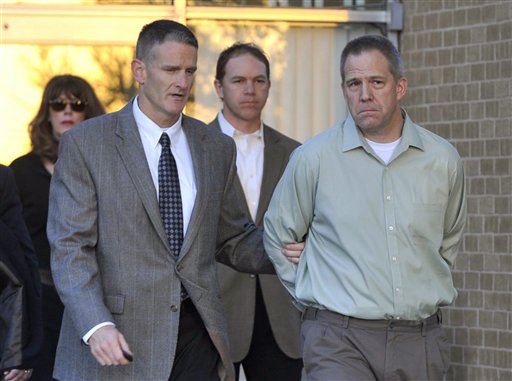 In this April, 2, 2012 file photo, JetBlue pilot Clayton Frederick Osbon, right, is escorted by FBI agents as he is released from The Pavilion at Northwest Texas Hospital in Amarillo, Tex.  Ten passengers filed a lawsuit, Wednesday, June 13, 2012 in Garden City, N.Y. against JetBlue over the flight during which Osbon had to be physically restrained after after running through the cabin yelling about Jesus and al-Qaida during a New York-to-Las Vegas flight in March.They claim the airline was "grossly negligent" in allowing him to fly. (AP Photo/Amarillo Globe-News, Michael Schumacher, File)