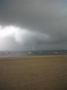 This photo provided by Joey Mure, shows a storm cloud over the Breezy Point area of Queens section of New York, on Saturday, Sept. 8, 2012. A Fire Department spokesman said there were power lines down and possibly other damage in the Point Breeze section of the Rockaway peninsula in Queens. The general manager of the Breezy Point Surf Club tells the Associated Press the storm ripped up cabanas and even picked up industrial-sized metal trash bins. The National Weather Service issued a tornado warning for Queens and Brooklyn as a line of strong thunderstorms moved through the city. The service said radar detected a "strong rotation" in the storm, but there was no immediate confirmation that a twister actually formed. (AP Photo/Joey Mure)
