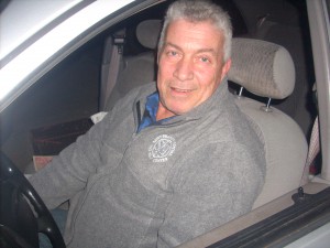 Haim Benbenichti of Westbury waited in his car more than 12 hours outside a Hicksville gas station Friday, Nov. 2, 2012 in anticipation of the next gasoline delivery. He had food delivered to his car from a nearby pizzeria. (Christopher Twarowski/Long Island Press)