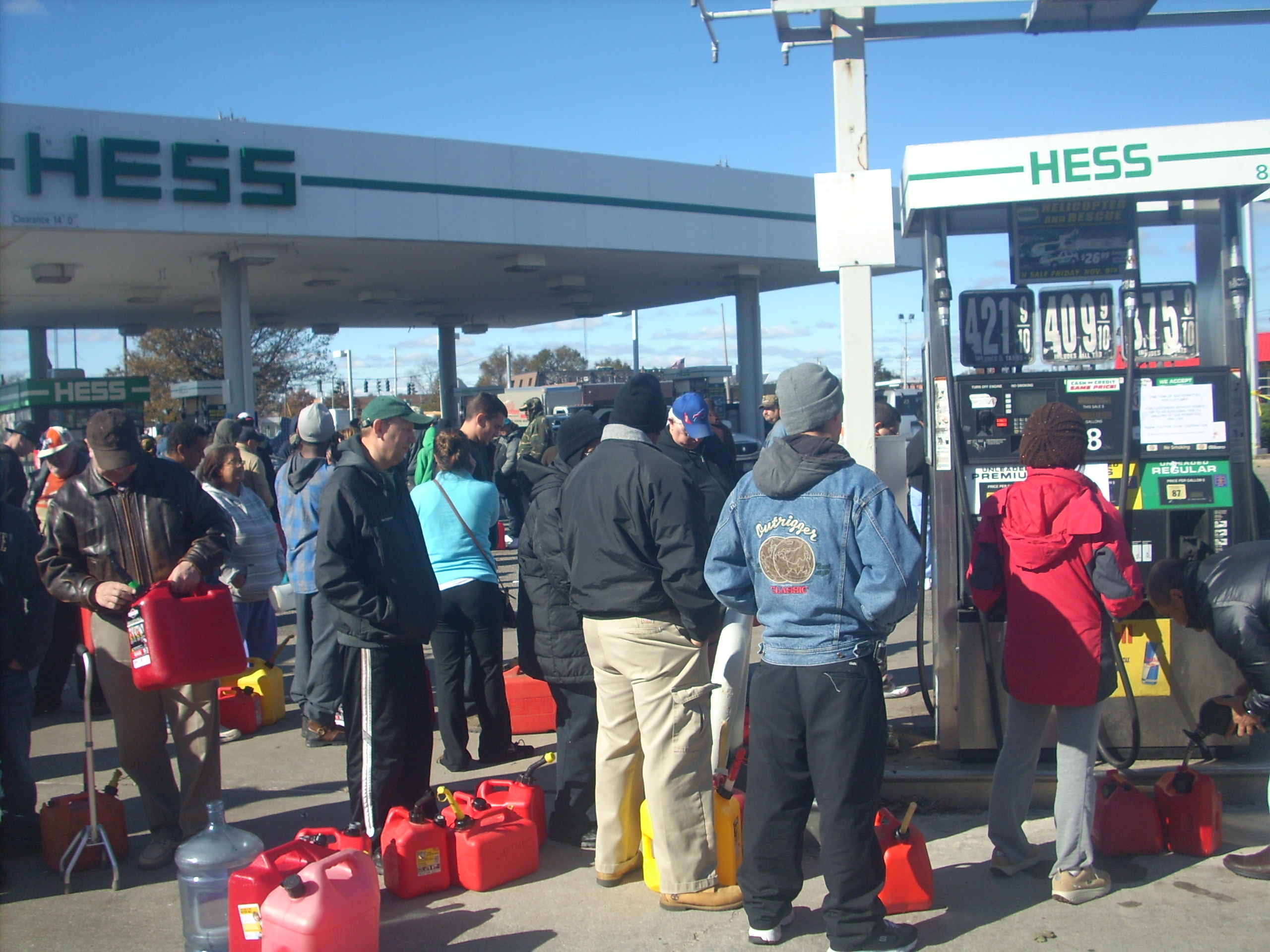 Walk-ups at a Hess gas station in Copiague Saturday, Nov. 3 filled cans and containers of all shapes and dimensions with fuel for their cars and generators, including buckets, water jugs and antifreeze bottles. (Christopher Twarowski/Long Island Press)