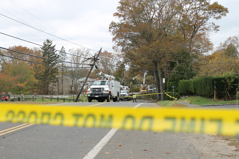 Long Island Power Authority crews working to restore power in East Northport on Wednesday. (Photo credit: Rashed Mian)