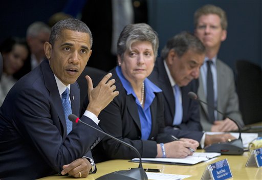 FILE - In this Oct. 31, 2012 file photo, President Barack Obama, accompanied by members of his Cabinet, speaks at the Federal Emergency Management Agency (FEMA) Headquarters in Washington to discuss Superstorm Sandy. From second left are Homeland Security Secretary Janet Napolitano, Defense Secretary Leon Panetta, and Housing and Urban Development (HUD) Secretary Shaun Donovan. Obama on Friday, Dec. 7, 2012 asked Congress for $60.4 billion in federal aid for New York, New Jersey and other states hit by Superstorm Sandy in late October. It's a disaster whose cost is rivaled only by the Sept. 11, 2001 terrorist attacks and the 2005 Hurricane that devastated New Orleans and the Gulf Coast. (AP Photo/Carolyn Kaster, File)