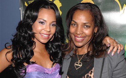 In this May 19, 2009, file photo, singer Ashanti Douglas, left, poses with her mother Tina Douglas at a press preview for the "The Wiz" at the New York City Center in New York.  (AP Photo/Evan Agostini, file)