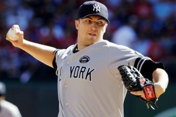 New York Yankees starting pitcher Phil Hughes delivers the ball to the Texas Rangers during the first inning at Game 2 of baseball's American League Championship Series Saturday, Oct. 16, 2010, in Arlington, Texas. (AP Photo/Tony Gutierrez)