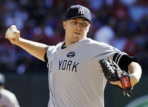 New York Yankees starting pitcher Phil Hughes delivers the ball to the Texas Rangers during the first inning at Game 2 of baseball's American League Championship Series Saturday, Oct. 16, 2010, in Arlington, Texas. (AP Photo/Tony Gutierrez)
