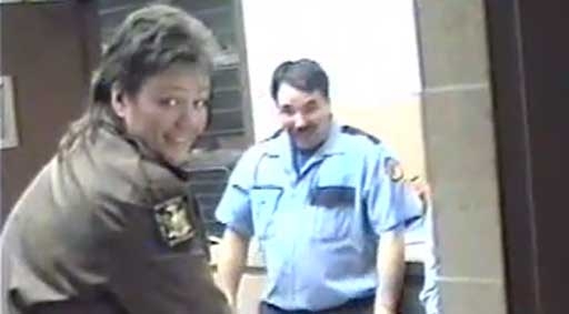 A screenshot of the "Kill The Kitty" video shot inside the Town of Hempstead Animal Shelter in Wantagh. Its disturbing footage shows Acting Shelter Director Pat Horan (left, with mullet) smiling and making obscene gestures while other workers lasso a kitten with a noose while a woman's voice off-camera shouts "Kill the kitty! Kill the kitty!". A town spokesman says the video, circulating on YouTube, is at least 17 years old and Horan has been reassigned pending an investigation.
