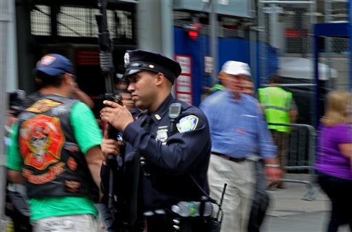 A Port Authority police officer walks towards a commuter train station near ground zero Saturday, Sept. 10, 2011 in New York. Heavily armed police remained a visible presence around New York on the eve of the 10th anniversary of the World Trade Center attacks.(AP Photo/Craig Ruttle)