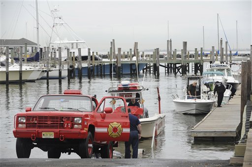 As Hurricane Sandy moves up the East Coast, members of the Highlands Fire Department remove the rescue boat from the Atlantic Highlands Marina, Friday Oct. 26, 2012 in Atlantic Highlands, N.J. (AP Photo/Joe Epstein)
