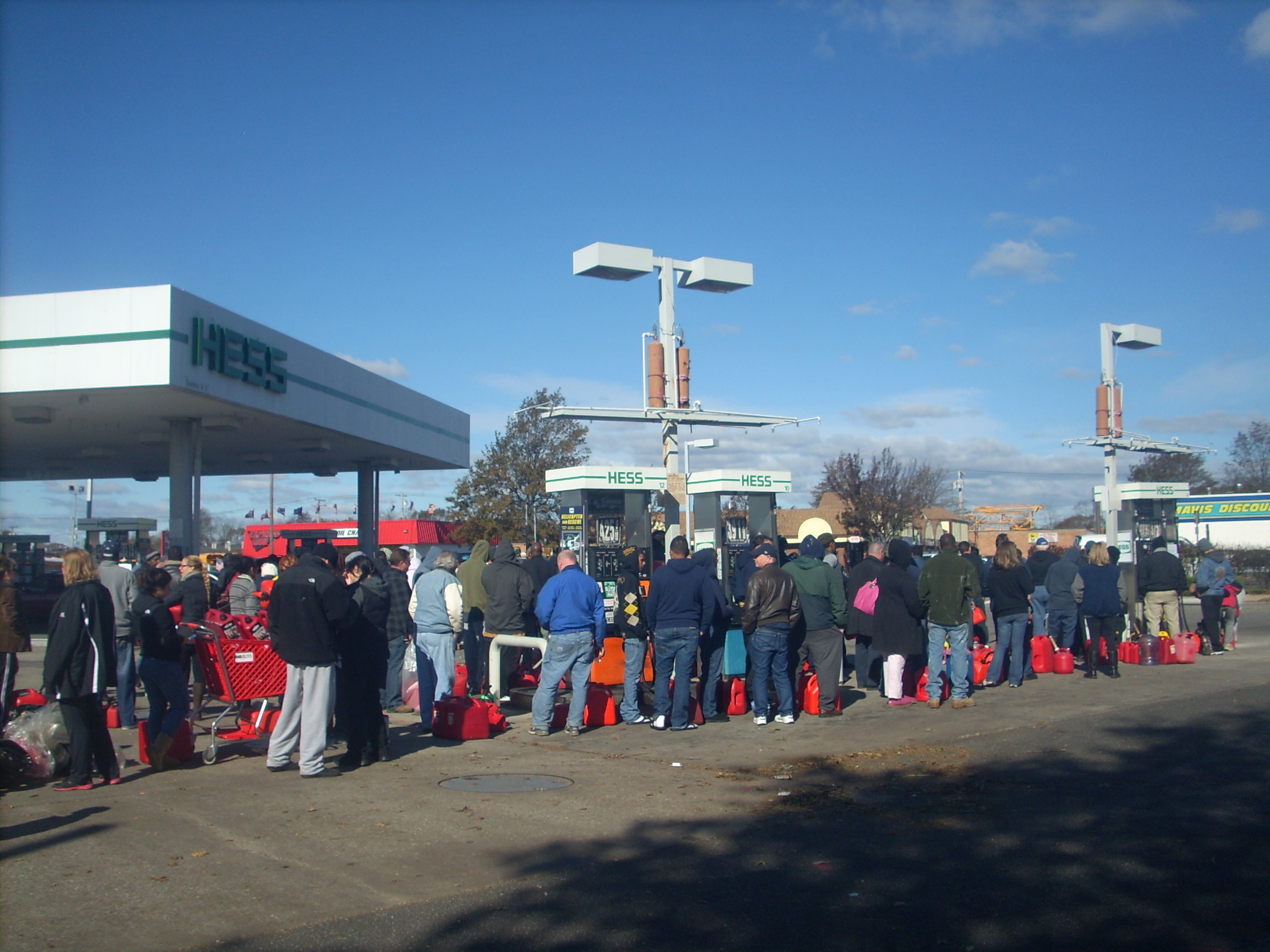 Hundreds of people swarmed a Hess gas station on Sunrise Highway in Lindenhurst on foot and by car Saturday, Nov. 3, 2012 to get as much fuel as they could as temperatures continued to drop and more than 700,000 residents remained without heat or electricity one week after Hurricane Sandy wreaked devastation across the Northeast. It was a familiar scene across Long Island. (Christopher Twarowski/Long Island Press)